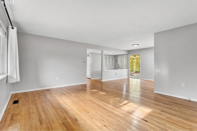 spare room featuring light hardwood / wood-style floors