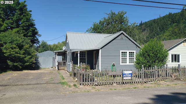 317 S Cedar St, Drain, OR 97435 - view of front of house featuring a metal roof