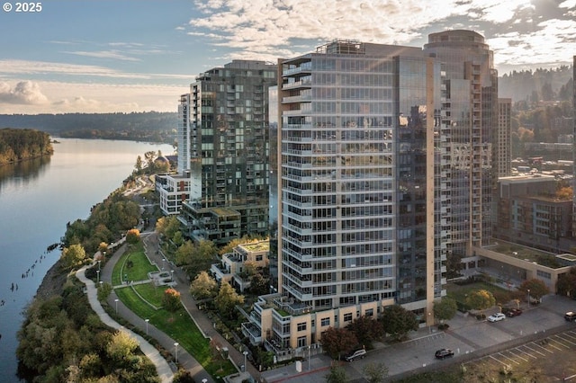 exterior space featuring a view of city and a water view