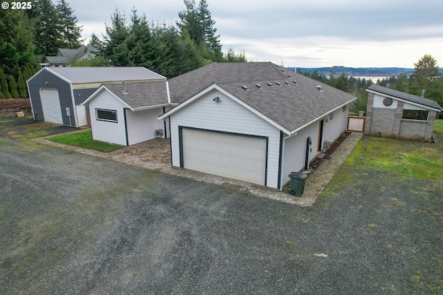 ranch-style house with an outbuilding