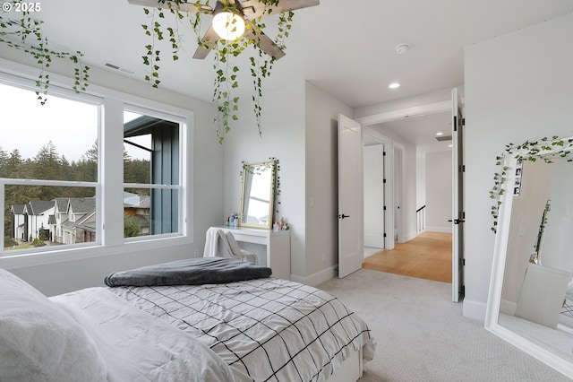 bedroom featuring recessed lighting, visible vents, baseboards, and carpet