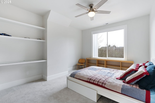 bedroom with visible vents, baseboards, carpet, and a ceiling fan