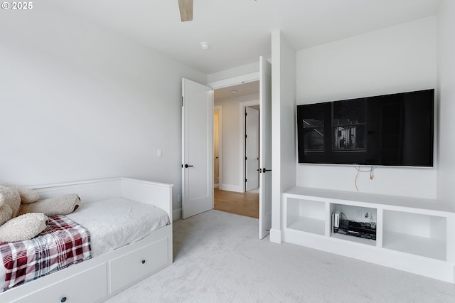 carpeted bedroom featuring baseboards