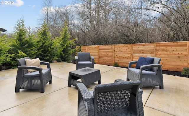 view of patio / terrace featuring fence