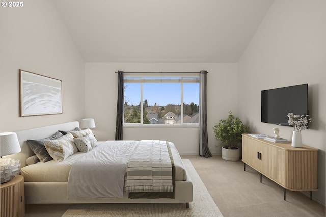 bedroom featuring light colored carpet and lofted ceiling