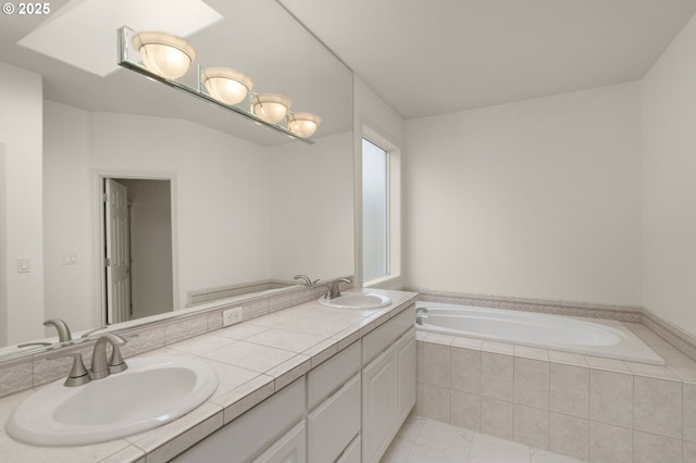 bathroom featuring double vanity, a sink, and a bath