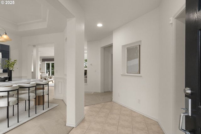 interior space featuring recessed lighting, light tile patterned floors, and light carpet