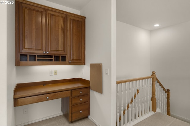 hall with recessed lighting and an upstairs landing