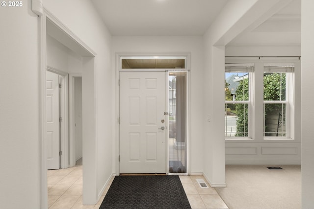 entrance foyer featuring light tile patterned floors and visible vents