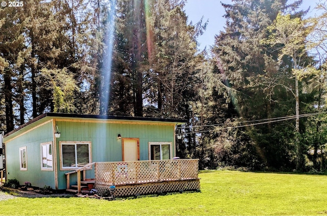 63579 Seven Devils Rd, Coos Bay, OR 97420 - back of house with a lawn and a deck