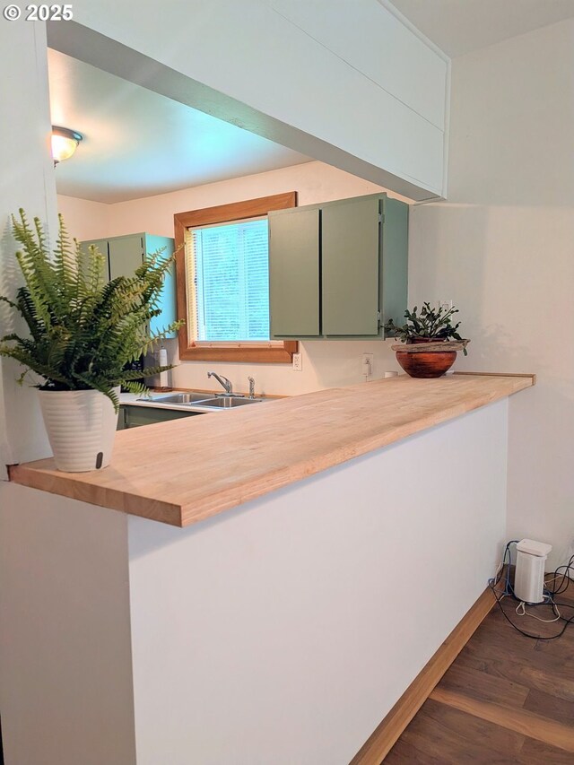 63579 Seven Devils Rd, Coos Bay, OR 97420 - kitchen with dark wood-style flooring, green cabinets, and wooden counters