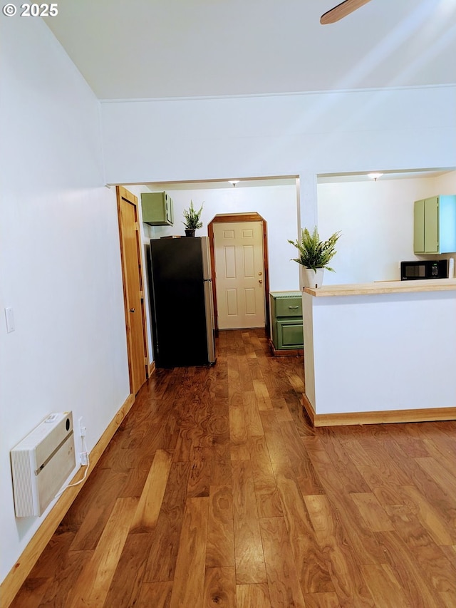 63579 Seven Devils Rd, Coos Bay, OR 97420 - hall with dark wood-type flooring and a wall unit AC