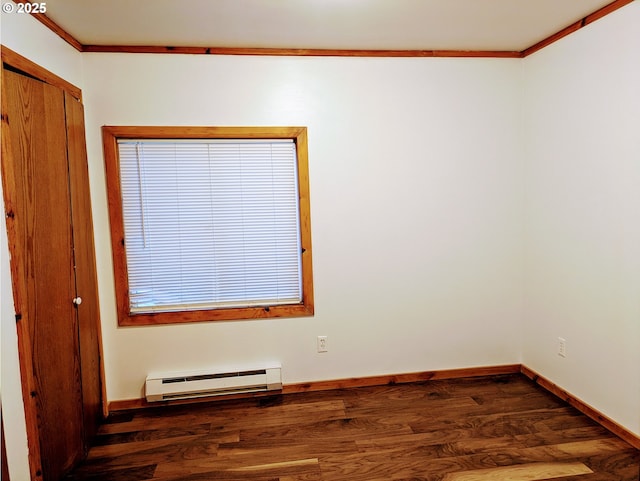63579 Seven Devils Rd, Coos Bay, OR 97420 - unfurnished room with a baseboard radiator, ornamental molding, and wood finished floors