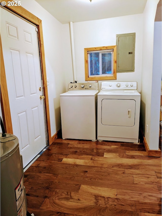 63579 Seven Devils Rd, Coos Bay, OR 97420 - washroom featuring electric panel, washer and dryer, and wood finished floors