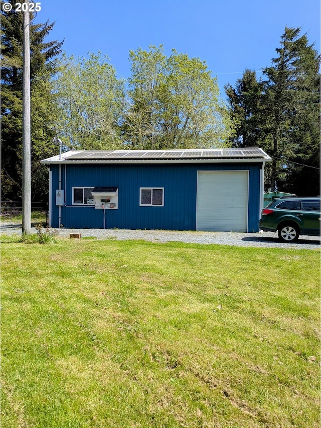 63579 Seven Devils Rd, Coos Bay, OR 97420 - view of home's exterior featuring a lawn, a metal roof, and an outdoor structure
