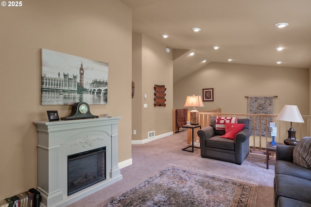carpeted living area featuring vaulted ceiling, baseboards, and recessed lighting
