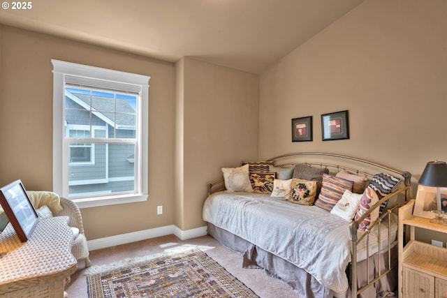 carpeted bedroom featuring baseboards