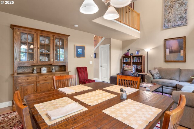 dining room with baseboards and wood finished floors