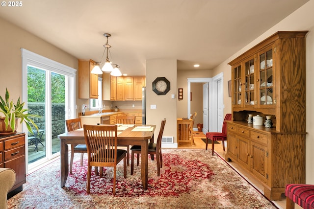 dining space featuring recessed lighting and light wood-style floors