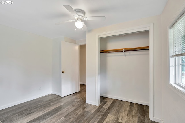 24344 NW Meacham Rd, North Plains, OR 97133 - unfurnished bedroom featuring wood finished floors, a closet, baseboards, and ceiling fan