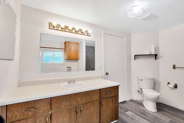 24344 NW Meacham Rd, North Plains, OR 97133 - bathroom featuring vanity, toilet, wood finished floors, and baseboards