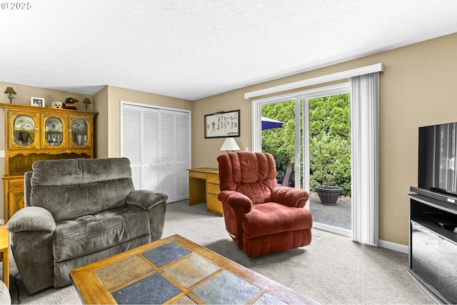 1018 S Holly Ct, Canby, OR 97013 - carpeted living area with a textured ceiling and baseboards