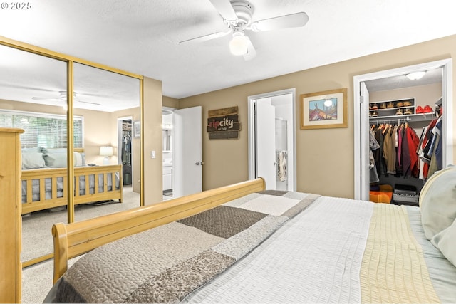 1018 S Holly Ct, Canby, OR 97013 - bedroom with a closet, a spacious closet, ensuite bath, a textured ceiling, and ceiling fan