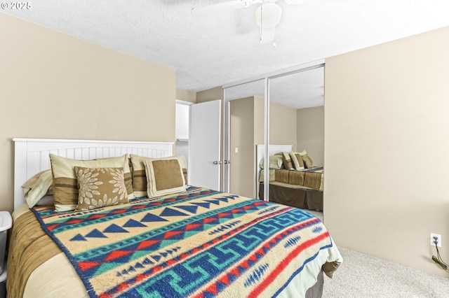 1018 S Holly Ct, Canby, OR 97013 - carpeted bedroom featuring ceiling fan, a closet, and a textured ceiling