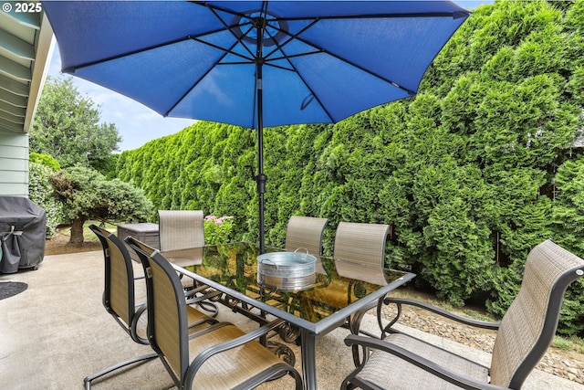1018 S Holly Ct, Canby, OR 97013 - view of patio / terrace featuring outdoor dining space, a grill, and a view of trees
