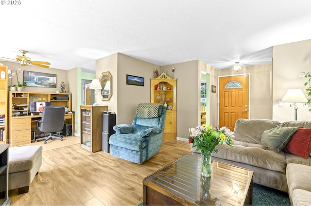 1018 S Holly Ct, Canby, OR 97013 - living area featuring a desk, wood finished floors, a ceiling fan, and a textured ceiling