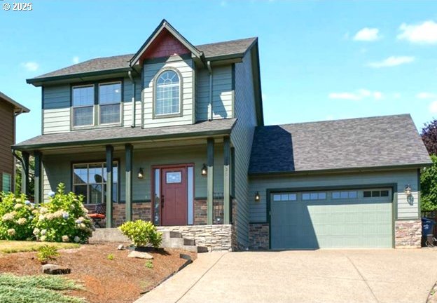 craftsman-style home featuring a porch and a garage