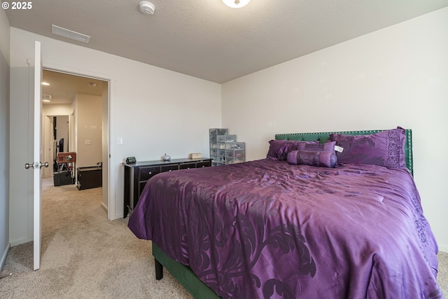 bedroom featuring light colored carpet