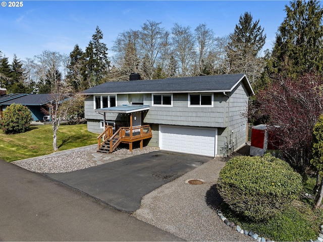35363 Woodland Ln, Astoria, OR 97103 - view of front of house with an attached garage, a chimney, driveway, and a front yard