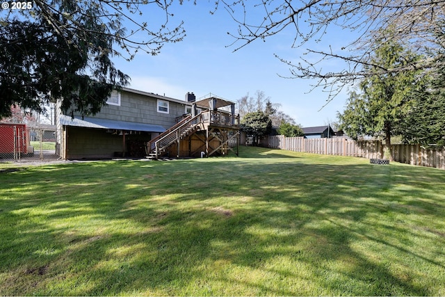 35363 Woodland Ln, Astoria, OR 97103 - view of yard with stairs, a deck, and a fenced backyard