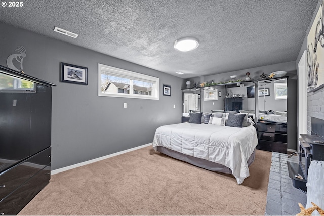 35363 Woodland Ln, Astoria, OR 97103 - bedroom with visible vents, a textured ceiling, baseboards, and carpet floors