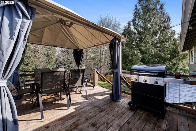 35363 Woodland Ln, Astoria, OR 97103 - wooden deck with a grill, outdoor dining space, and a gazebo