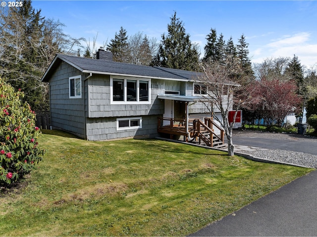35363 Woodland Ln, Astoria, OR 97103 - raised ranch featuring a chimney and a front yard