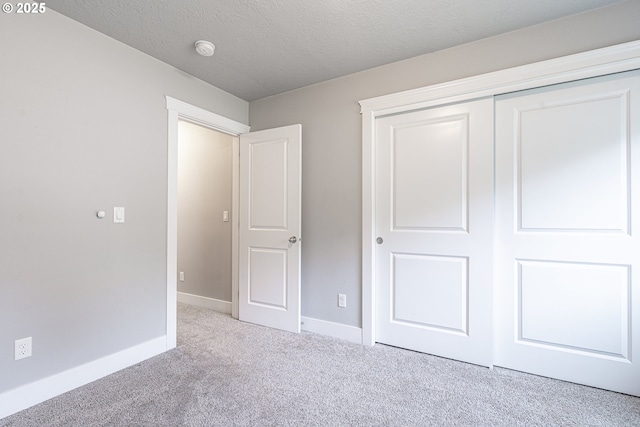 2474 Equestrian Loop S, Salem, OR 97302 - unfurnished bedroom with carpet, a closet, and a textured ceiling