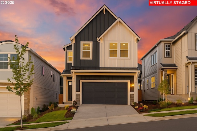 11855 SW Bosley Ter, Beaverton, OR 97007 - view of front of home featuring board and batten siding, concrete driveway, an attached garage, and a standing seam roof