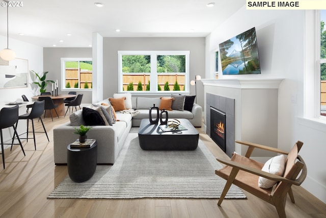 11855 SW Bosley Ter, Beaverton, OR 97007 - living room featuring a glass covered fireplace, light wood-style flooring, and recessed lighting