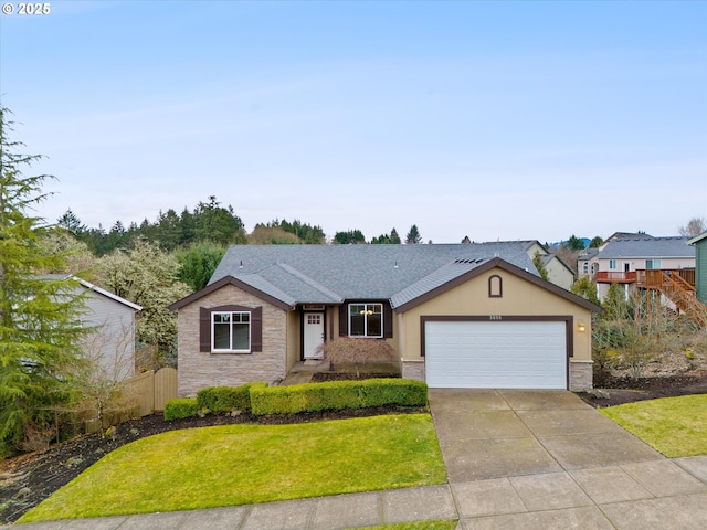 single story home with a garage and a front lawn