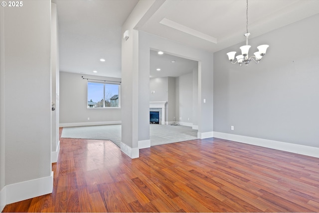 interior space with hardwood / wood-style flooring and a chandelier