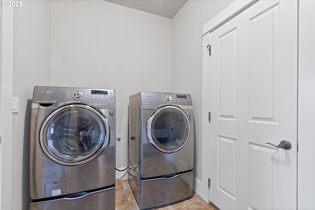 clothes washing area with independent washer and dryer