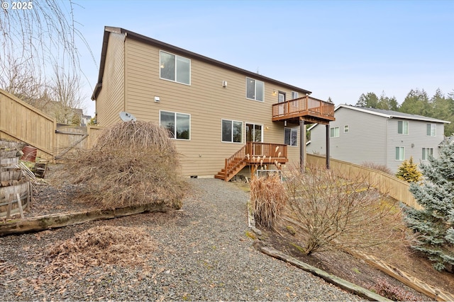 rear view of house with a wooden deck