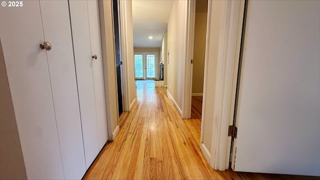 corridor featuring light hardwood / wood-style floors