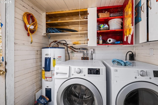 490 W 4th Ave, Eugene, OR 97401 - washroom with water heater, washing machine and clothes dryer, and wooden walls
