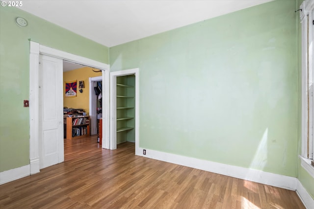 490 W 4th Ave, Eugene, OR 97401 - unfurnished room featuring wood finished floors and a smoke detector
