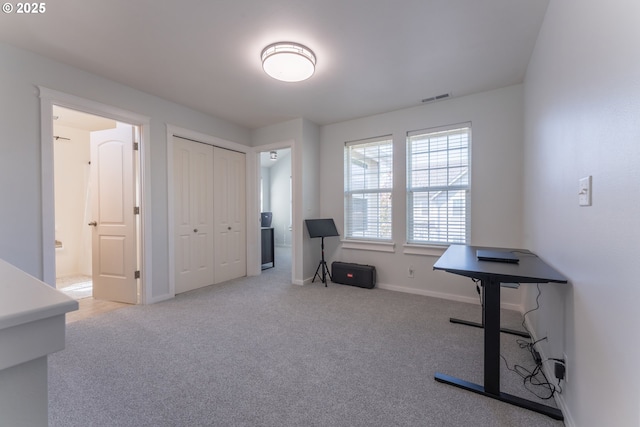 interior space featuring baseboards and visible vents