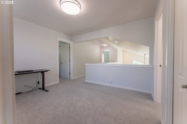 additional living space featuring carpet and baseboards