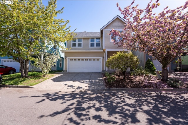 view of front of home with an attached garage and concrete driveway